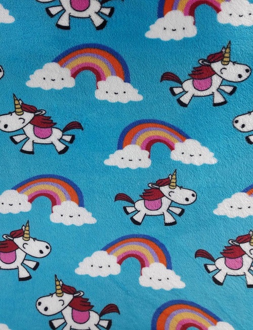 Pile a pelliccetta con unicorno fondo turchese